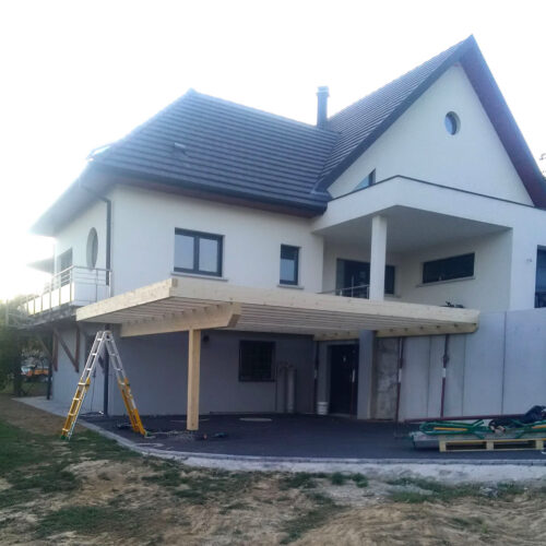 Pose d'un carport structure bois adossé à une maison sue deux cotés